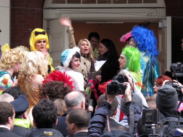 Photograph by Harvard Magazine/LL Actress Claire Danes waves to an animated crowd before entering Farkas Hall.
