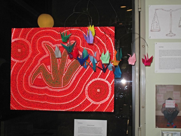Photograph by Harvard Magazine/LL Junior Mark Jahnke's <i>Calligraphy Dreaming,</i> a dot painting made in Ali Asani's Culture and Belief 12: “For the Love of God and His Prophet,” was created with the intention of "taking Islam and molding it to a local setting." This painting imagines how Australian Aborigines might adapt Muslim calligraphy into their traditional artwork and paintings.