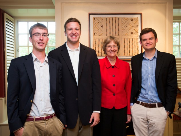 Photograph by Stephanie Mitchell/Harvard News Office Harvard President Drew Faust greets the winners of the President's Challenge for social entrepreneurship in her office, in advance of the public announcement of their win. Florian Mayr '13 (from left), Matthew Polega '13, Drew Faust, and Scott Crouch '13 are pictured in Massachusetts Hall.