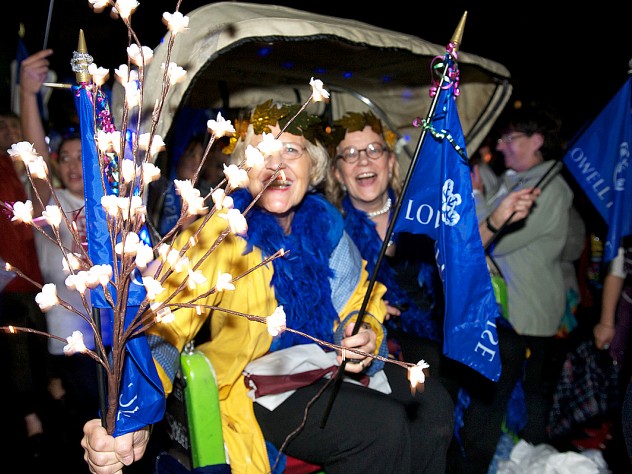 Photograph by Jim Harrison Lowell House co-masters Dorothy Austin and Diana Eck were carried by House residents in a rickshaw as part of the parade.
