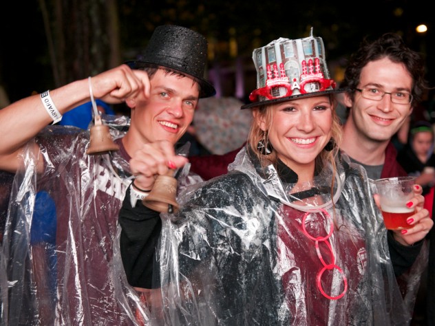 Photograph by Jim Harrison Students from the Harvard Business School (HBS) party on despite the rain. The HBS contingent in the parade carried replicas of the centennial bell from that school's 2008 anniversary.