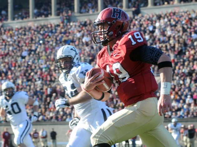 Mark Kelsey / Harvard Crimson Record-setting quarterback Colton Chapple ran for one touchdown, set up another with a 61-yard breakaway, and passed for two more. He ended the game with a career-high 128 yards rushing.