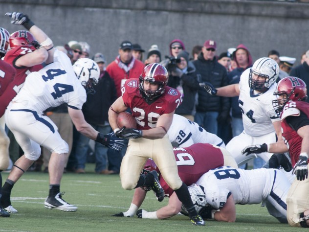 Photograph by Robert Worley Despite an up-and-down day (two fumbles), running back Paul Stanton Jr. ’16 (number 29) led the Crimson with 109 yards rushing—20 of which came on the final drive. A notable blocker was 2013’s leading receiver Ricky Zorn '14-'15 (number 5), who had missed the entire 2014 season but made it back for The Game.