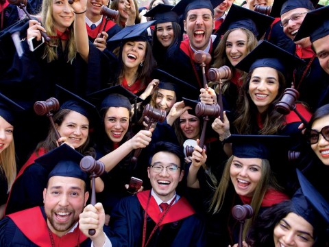 Law School graduates flaunt their profession’s symbol of authority.