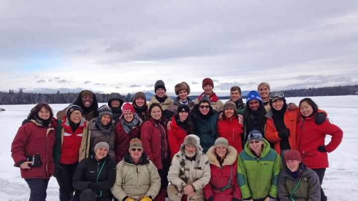 Students, guides, and House Master Anne Harrington (far left) pose on the frozen lake.