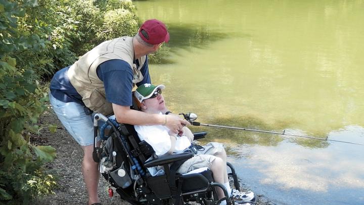 Tim Stevens, a longtime patient, fishes with his stepfather.