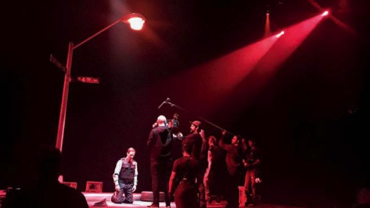 Photograph of a camera crew filming the stage production of Pass Over