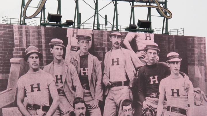 The JunboTron showed Harvard baseball photographs from years past.