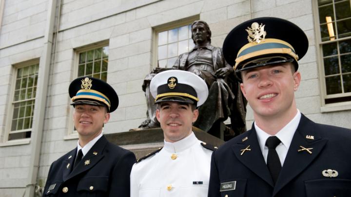 Newly commissioned officers: Second lieutenants Scherer and Higgins flank Midshipman Reach.