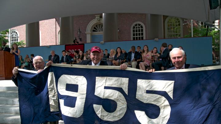 Members of the Class of 1955 display a banner in their "class color," blue. The Class of 2012 are reviving the "class color" tradition, and their color is also blue. 