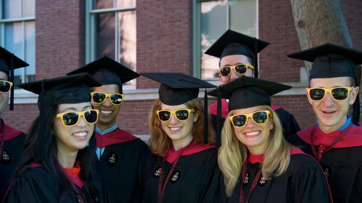 Ready for anything, Harvard Business School M.B.A.s-to-be fend off the sun in their matching "HBS Section J 2012" shades.