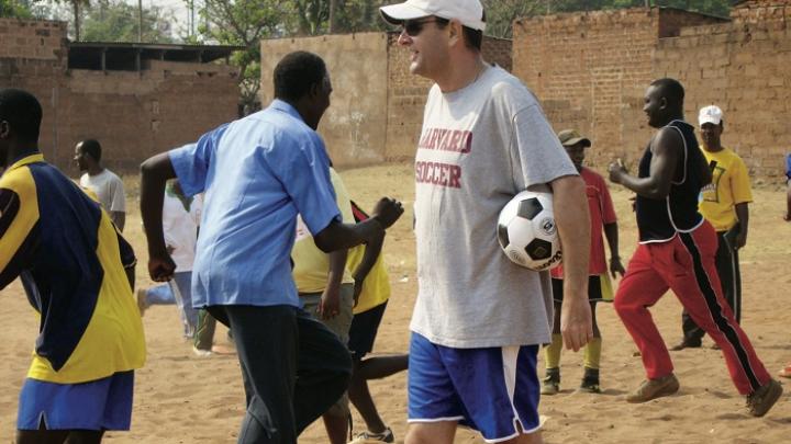 Nick Gates ’91, who founded Coaches Across Continents, works with coaches (above) and youths (at right) in Tanzania in 2009. 