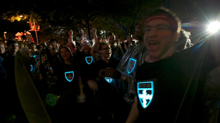 Students of the Harvard School of Engineering and Applied Sciences wore LED T-shirts with the school's insignia.