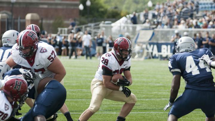 In rambling for 139 and four touchdowns, Andrew Casten '15 was often untouchable behind bulldozing blockers such as center Nick Easton '15 (57). Casten has already scored seven touchdowns this season.