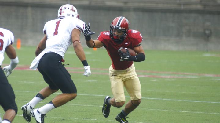 One on one: Harvard wide receiver Andrew Fischer ’16 proved ultra-elusive to his opposite number, Jared Roberts. Fischer had 237 all-purpose yards and his 78-yard second-quarter touchdown reception is the eighth longest scoring pass in Crimson history.