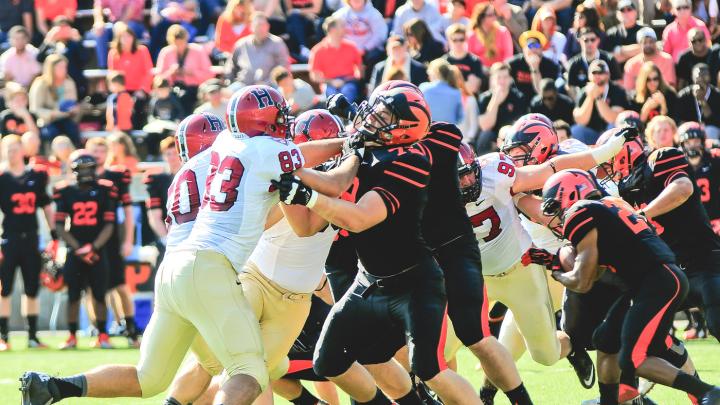Princeton ballcarriers such as Dre Nelson (number 23) found nowhere to run--and nowhere to hide--when collapsed on by Crimson defenders including Davon Robertson ’17 (number 83) and James Duberg ’16 (number 97).