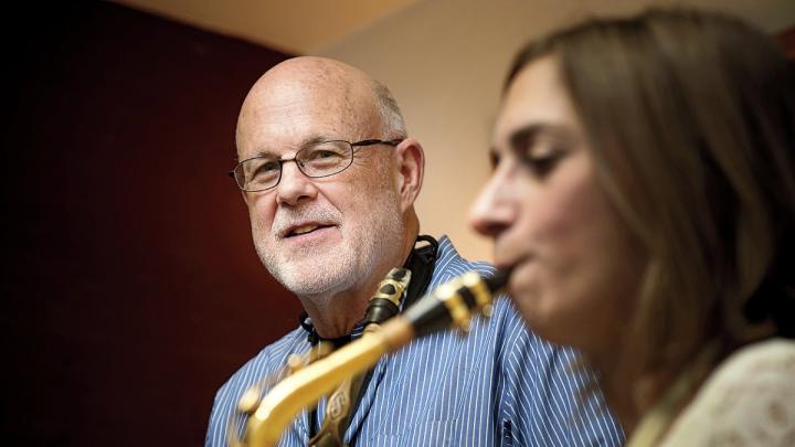 John Payne teaches a saxophone student at his music center in Brookline, Massachusetts.