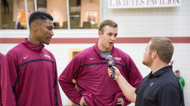 Team captain Evan Cummins '16 (shown during an interview at Crimson Madness) will play a key role leading the Crimson. Teammate Zena Edosomwan is at left.