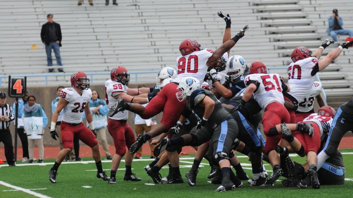 Freshman defensive lineman Richie Ryan (far right, 50) got his hand up to block a first-quarter field-goal try by Columbia's Cameron Nizialek. 