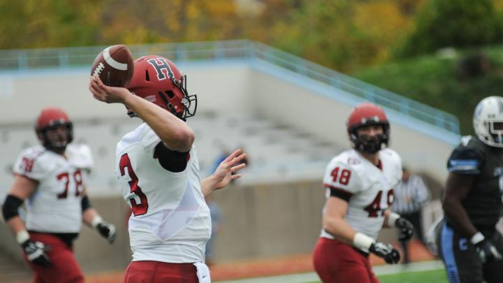 Senior special: Quarterback Scott Hosch threw to tight end Ben Braunecker (48), who caught the ball in stride and took it 53 yards for Harvard's first score.