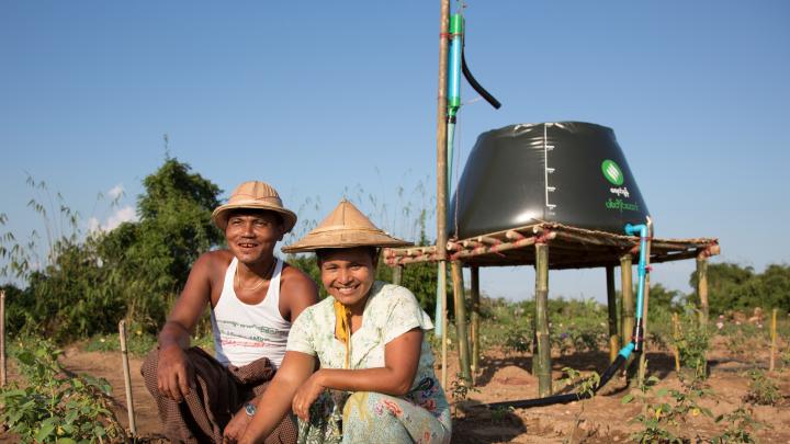 Proximity Designs' water basket in farm use: using a treadle pump, farmers can collect and move water and then distribute it by hose or drip irrigation lines—huge improvements in time and labor compared to bearing buckets of water on their shoulders with a wooden yoke.