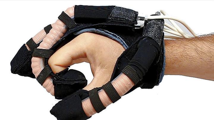 A soft robotic glove intended for hand rehabilitation therapy uses fluid-powered elastic tubes to mimic finger movements. 