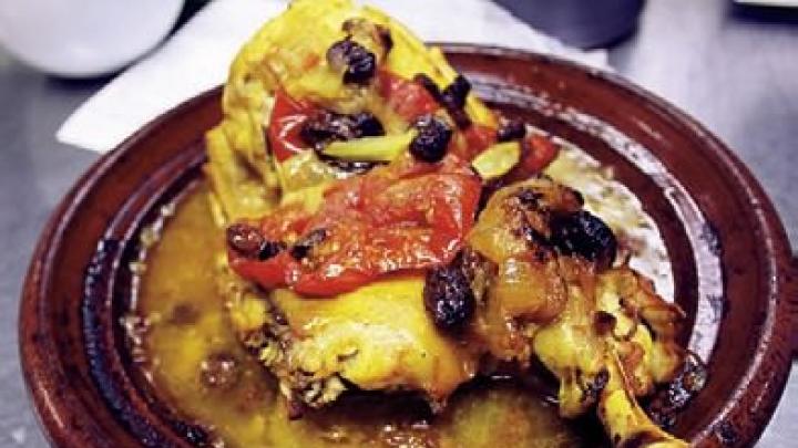 Moroccan roast chicken with onions, tomatoes, and raisins