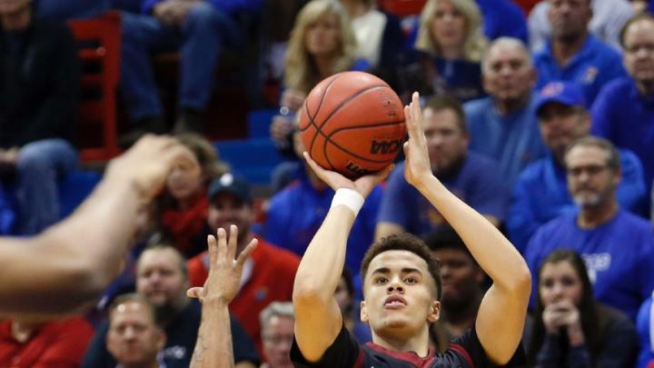 Corey Johnson ’19 (shown here against Kansas) sank six three-pointers in the BU game to lead the Crimson to a 75-69 victory. 
