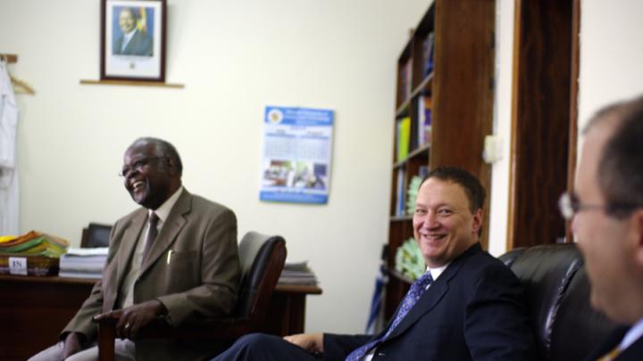 David Bangsberg (center) meets with Frederick Kayanja, vice chancellor of Mbarara University of Science and Technology (MUST) in Mbarara,Uganda, in Kayanja's office.