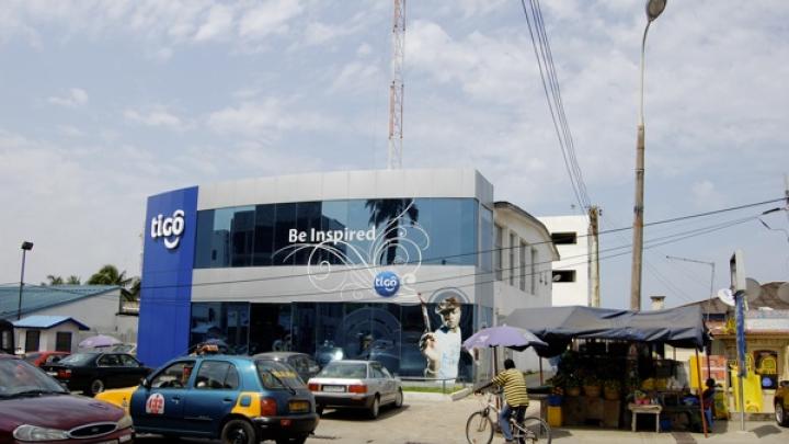 On Oxford Street, in the busy Osu section of Accra, glass-fronted bank buildings represent the nation's developing future.