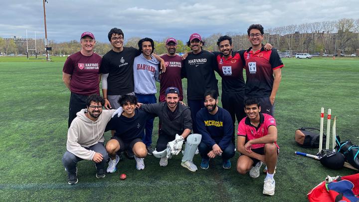 members of the Harvard cricket team pictured before a game on a field