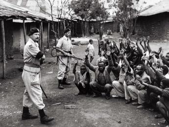 British soldiers and local police searching homes to interrogate subjects during Mau May rebellion, c. 1954
