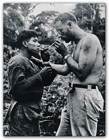 In the rain forest in 1952, Professor Schultes takes a tobacco snuff. From Wade Davis's One River. 