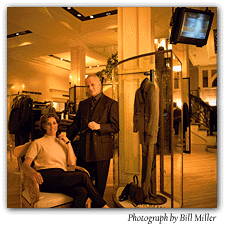Murray Pearlstein and his daughter Debi Greenberg, showcased in his store. He is wearing a brown suit from his private label, Louie. Photograph by Bill Miles.