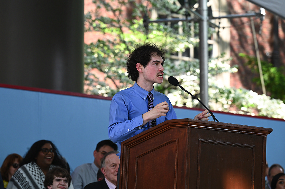 man speaking at podium