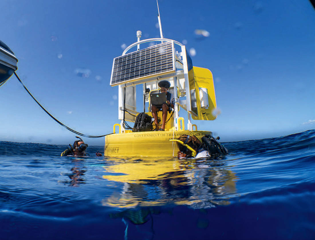 Darren Gibbons, Yaniv Alumna, and Odel Harve at a whale listening station anchored to the seafloor.