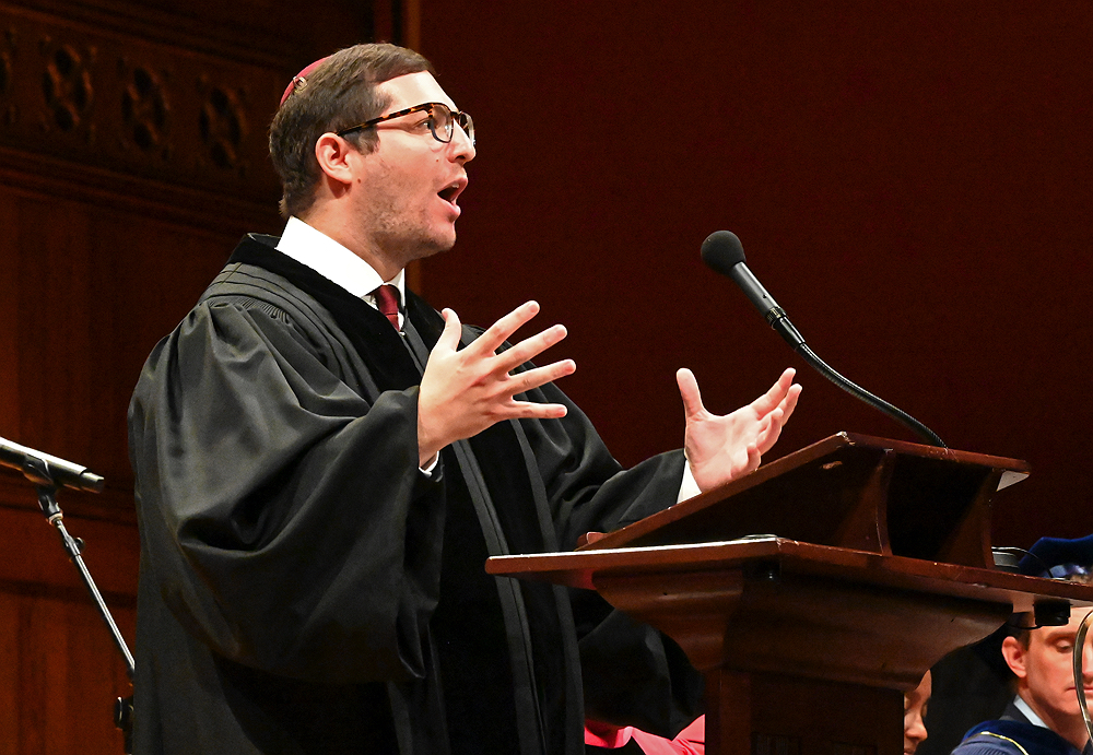 Rabbi Noah Marlowe addresses audience at Sanders Theater