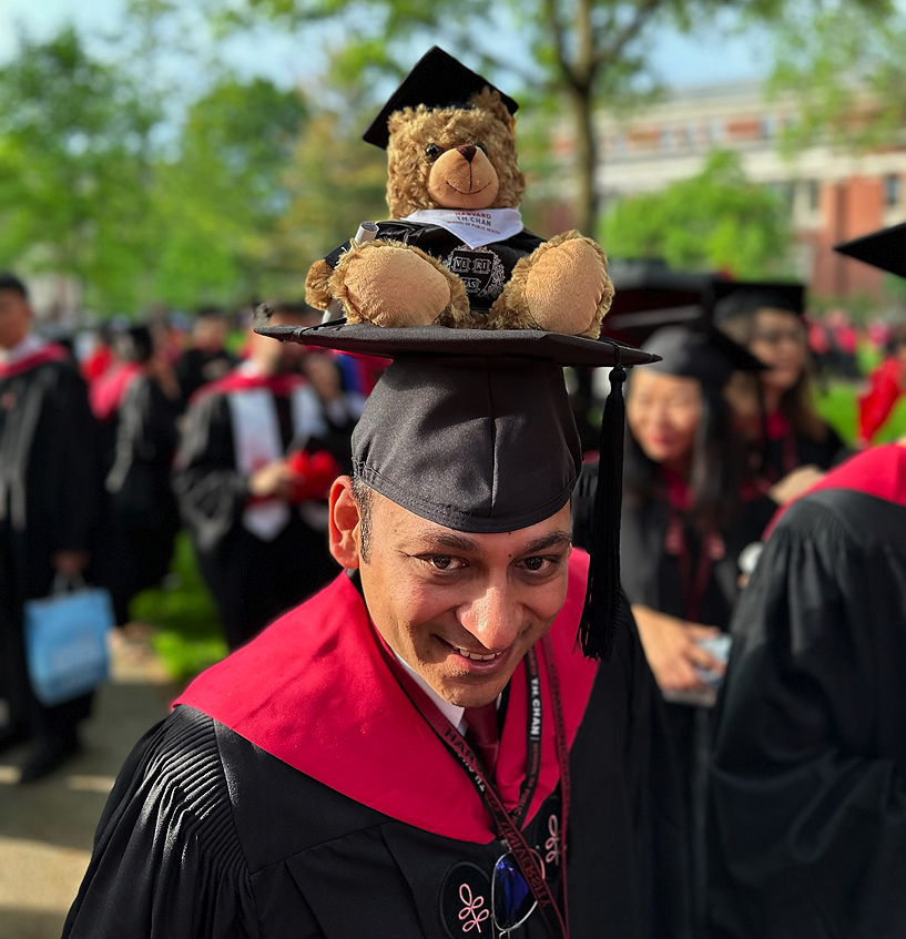 Graduate with teddy bear on his mortar board