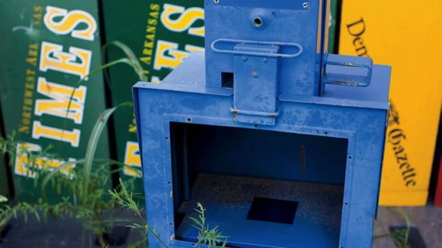 Photo of abandoned newspaper vending boxes