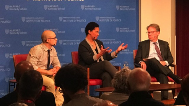 The three panelists on stage at the Kennedy School.