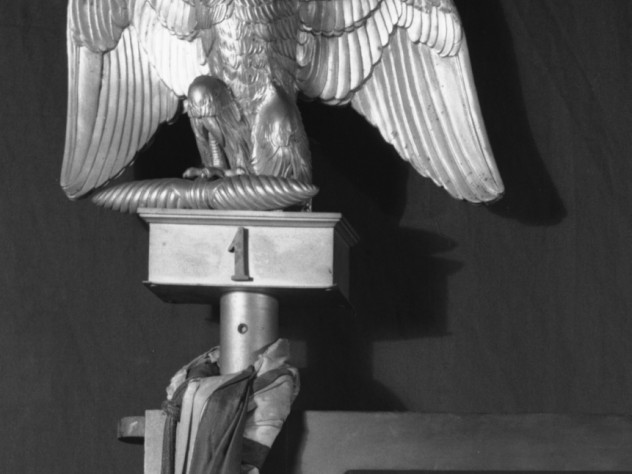 Finial in the form of an eagle. Gilt metal (bronze), French, 1813–1814, approximately 10 inches high. This originally sat on the top of the pole support of a silk Napoleonic flag in the Short Gallery. The flag was not taken by the thieves. The finial is made of bronze, but may have had the appearance of gold to the thieves.