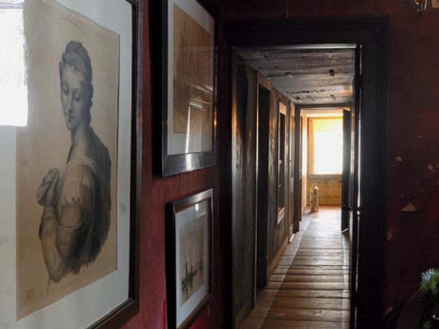 A hallway with hanging artwork in The Evergreens