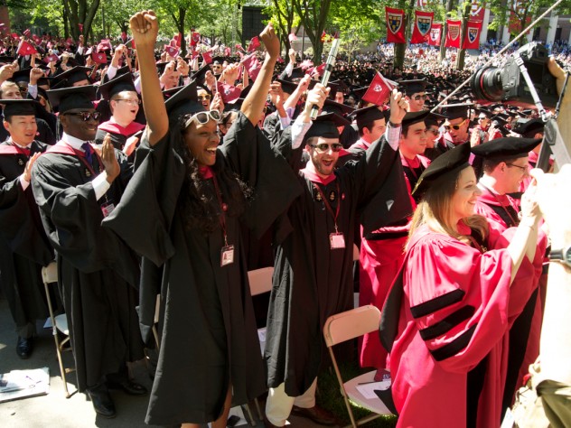 Photograph by Jim Harrison College and doctoral students express their sentiments, loudly, at Commencement.