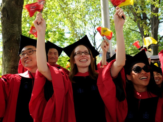 Photograph by Stu Rosner Having just received their degrees, newly minted Harvard Ph.D.s, in their distinctive doctoral gowns, celebrate the culmination of years of study.