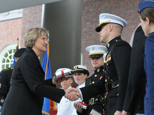 Photograph by Jim Harrison President Faust congratulates the officer candidates. She gave each of them a copy of <i>The Sleepwalkers: How Europe Went to War in 1914.</i>
