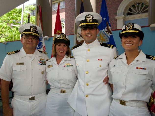 Navy ensign Adam Gracia’s sister, Alexandra (at right), administered his oath of office, and his parents pinned on his insignia.