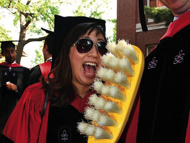 Photograph by Stu Rosner New doctor of medical sciences in oral biology (D.M.Sc.) degree-recipients Mindy Gil, D.M.D. ’11, of Palos Verdes, California, and Peter Charles Grieco, of Garfield, New Jersey, reminding revelers about good dental hygiene