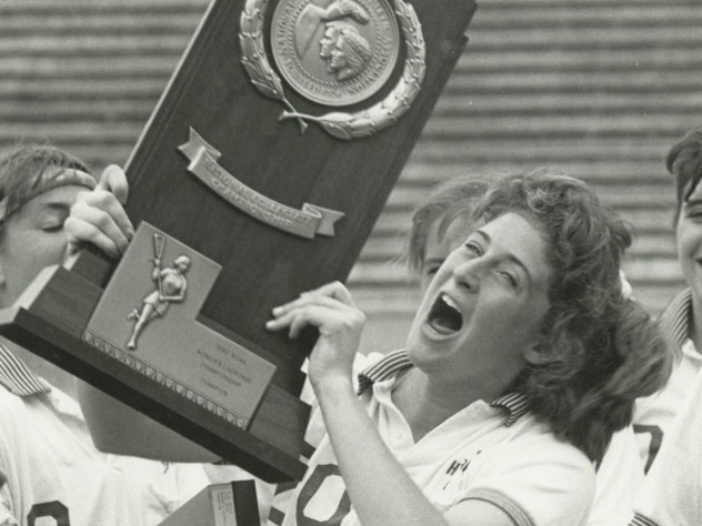 Photograph courtesy of Harvard Athletic Communications Julie Smail ’90 celebrates the Crimson’s winning of the NCAA national championship.