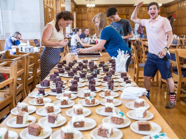 Photo of Yale CS50 students enjoying cake