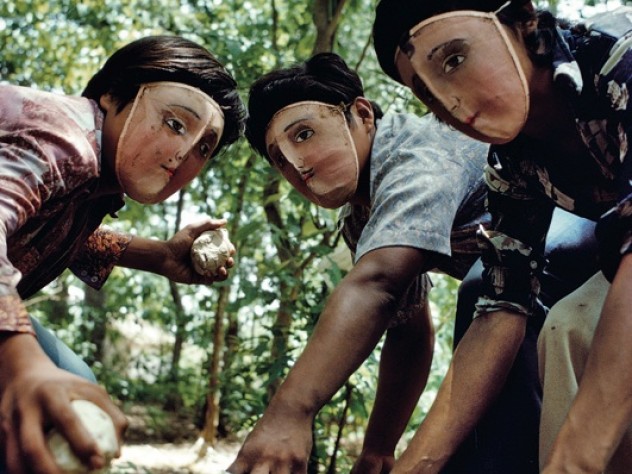 Photograph by Susan Meiselas/Magnum Photos Rebels from the town of Monimbo, Nicaragua, wear traditional Indian dance masks while holding homemade contact bombs. “Some people wore masks so if the Guard managed to see them, they wouldn’t recognize them. If they recognized them, they’d come back at night and take them.” —Monimbo woman, from <em>Pictures from a Revolution</em>